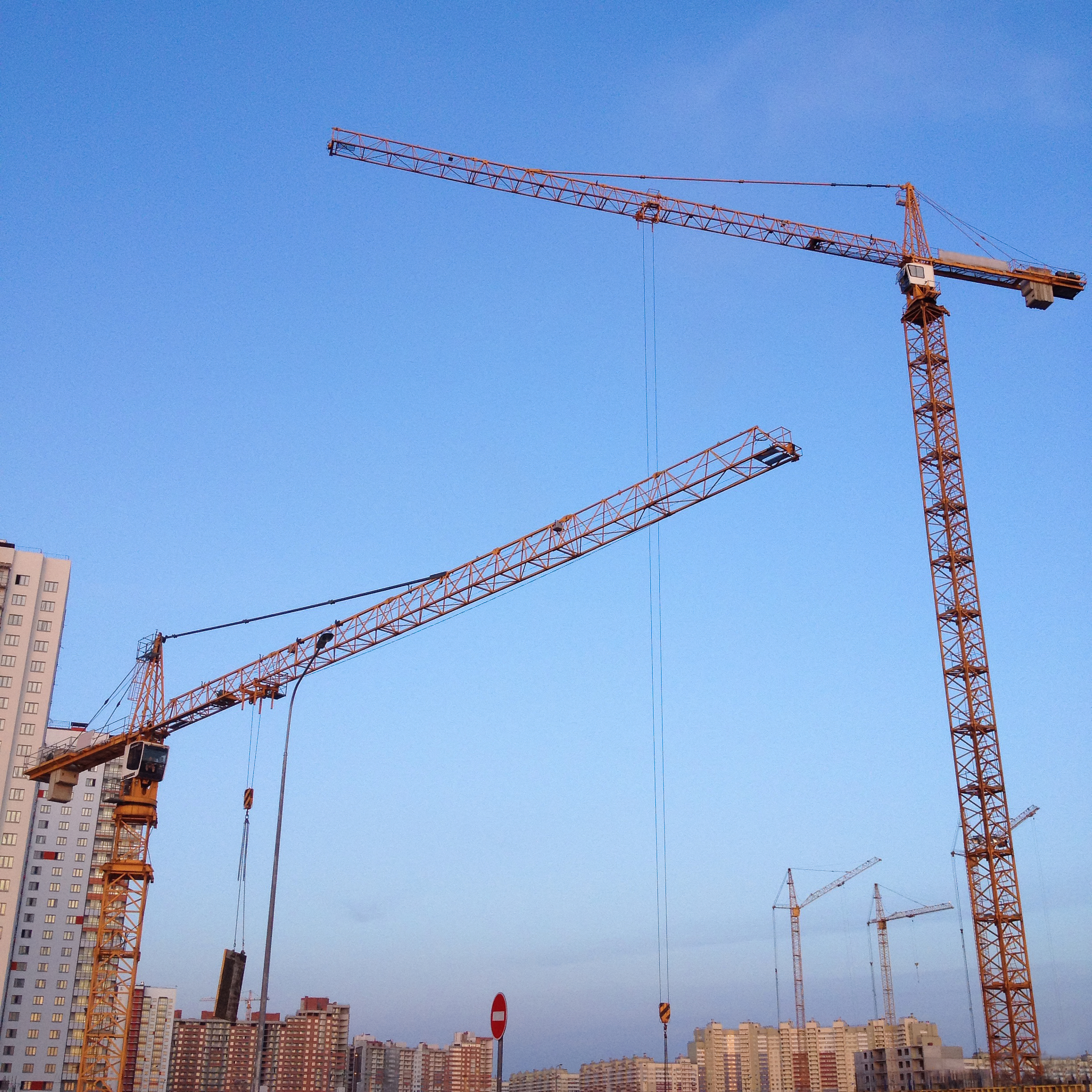 cranes-against-blue-sky